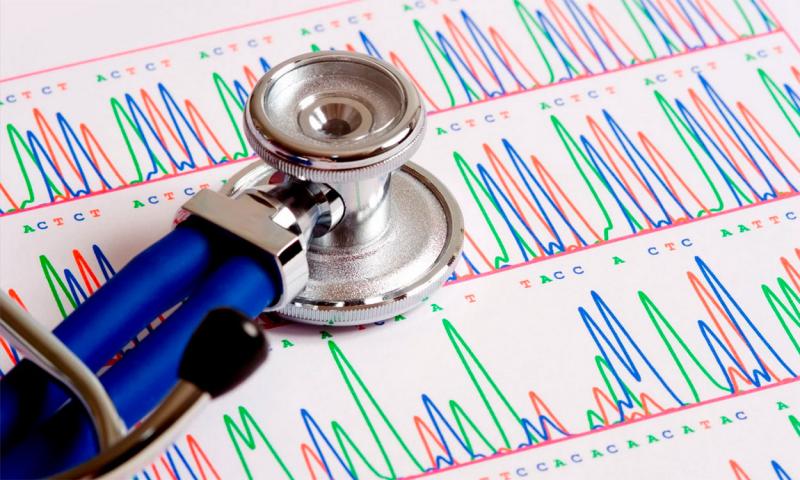 Stethoscope atop a gentic sequencing report.