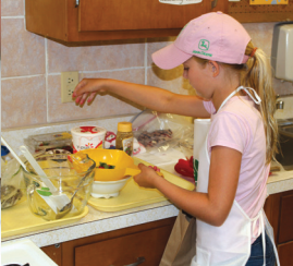 Special Food Contests LG Youth girl cooking in kitchen.