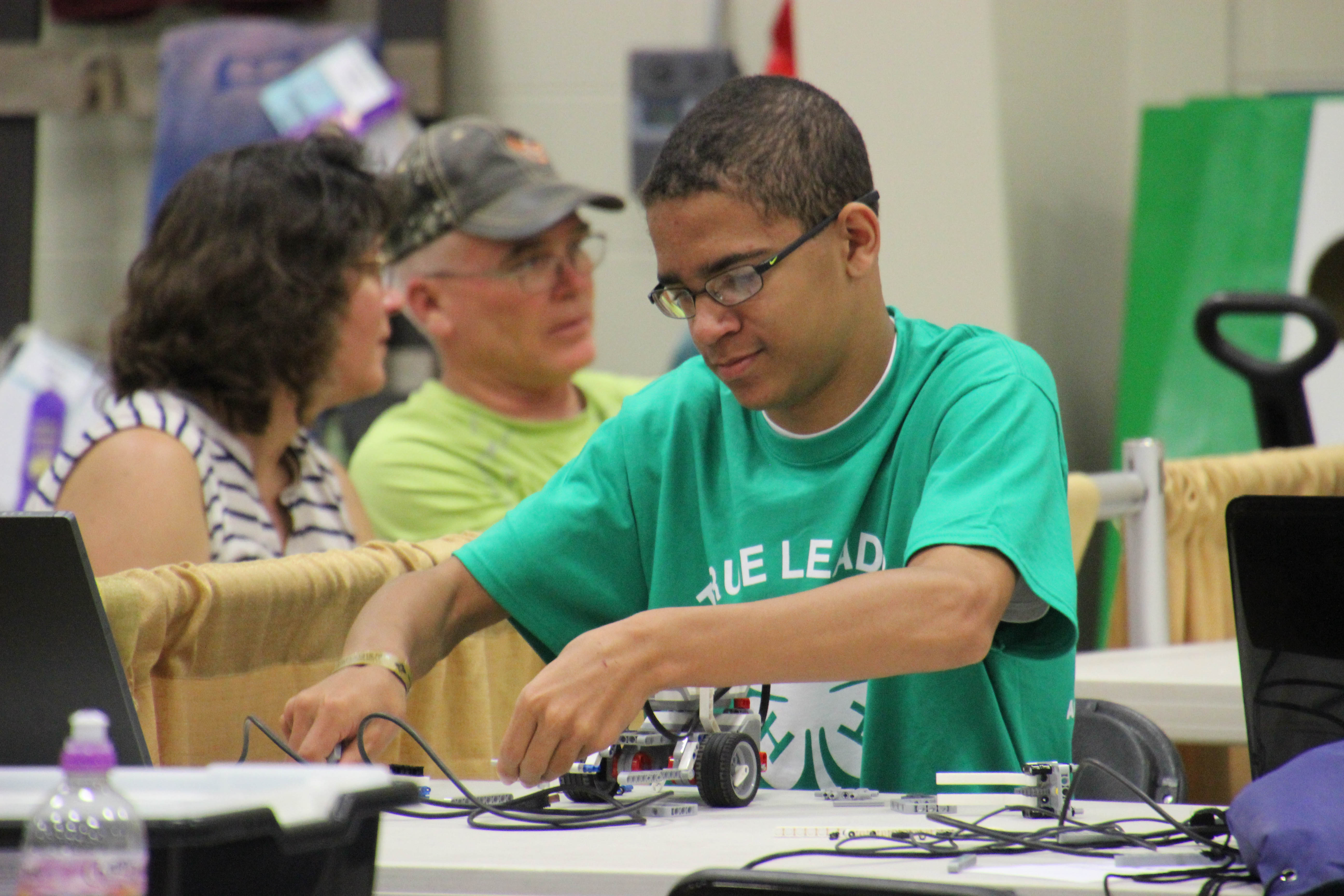 4-H member working on a robotics project