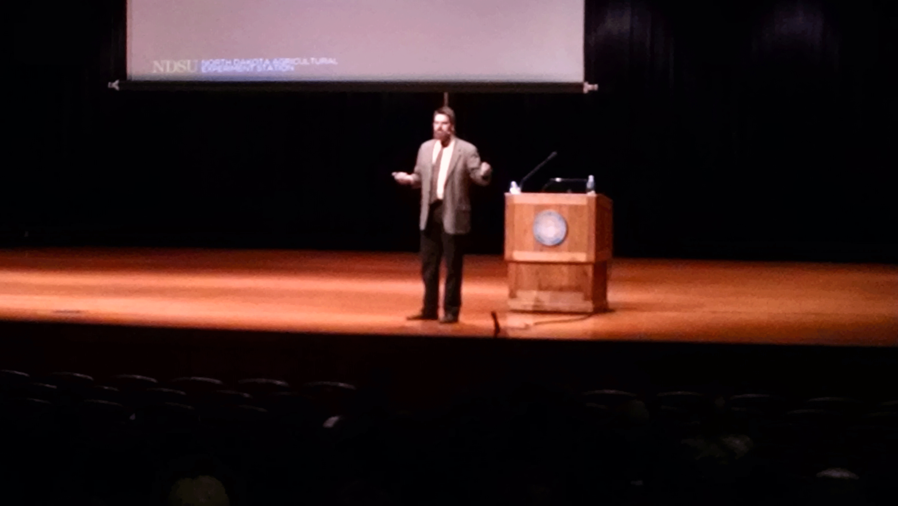 Eric Berg, professor of animal science at NDSU, giving a presentation