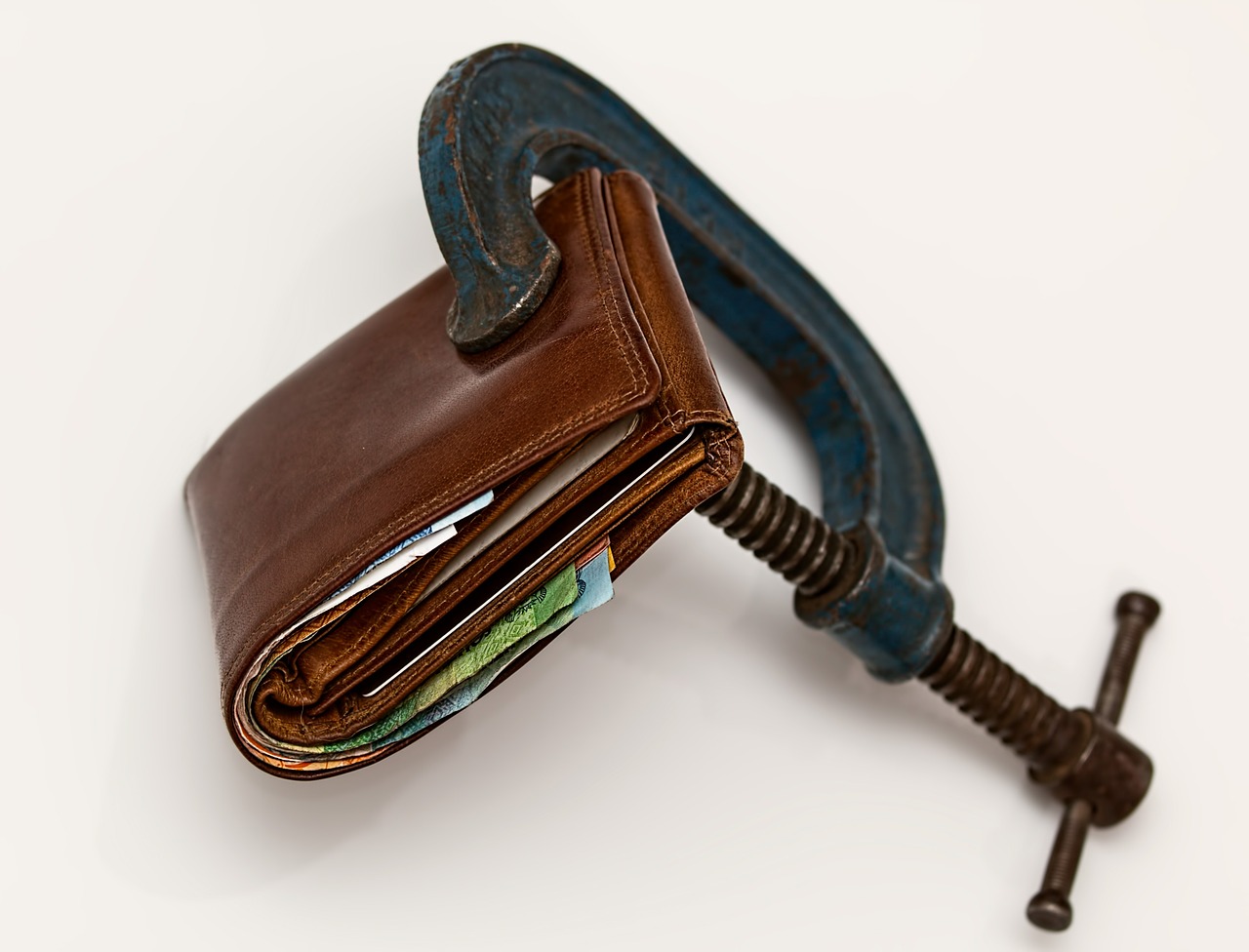 A wallet inside a tight clamp.