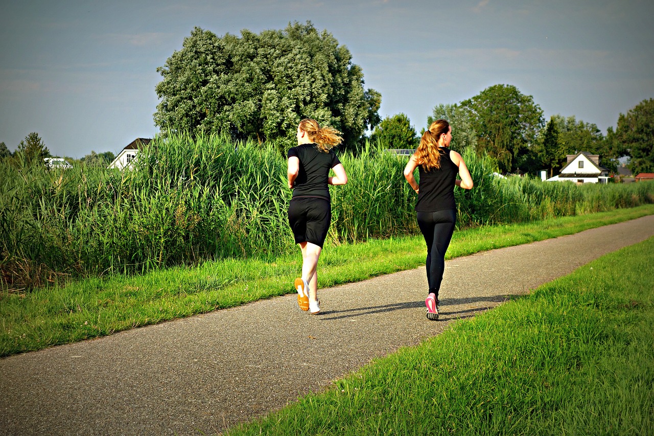 Two women jogging in the country