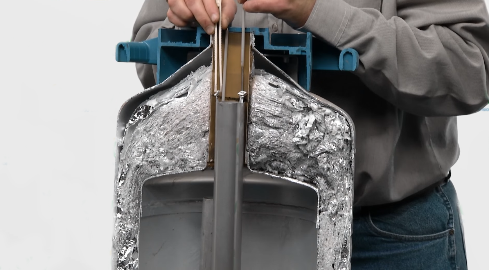 semen straw being thawed in a liquid nitrogen tank