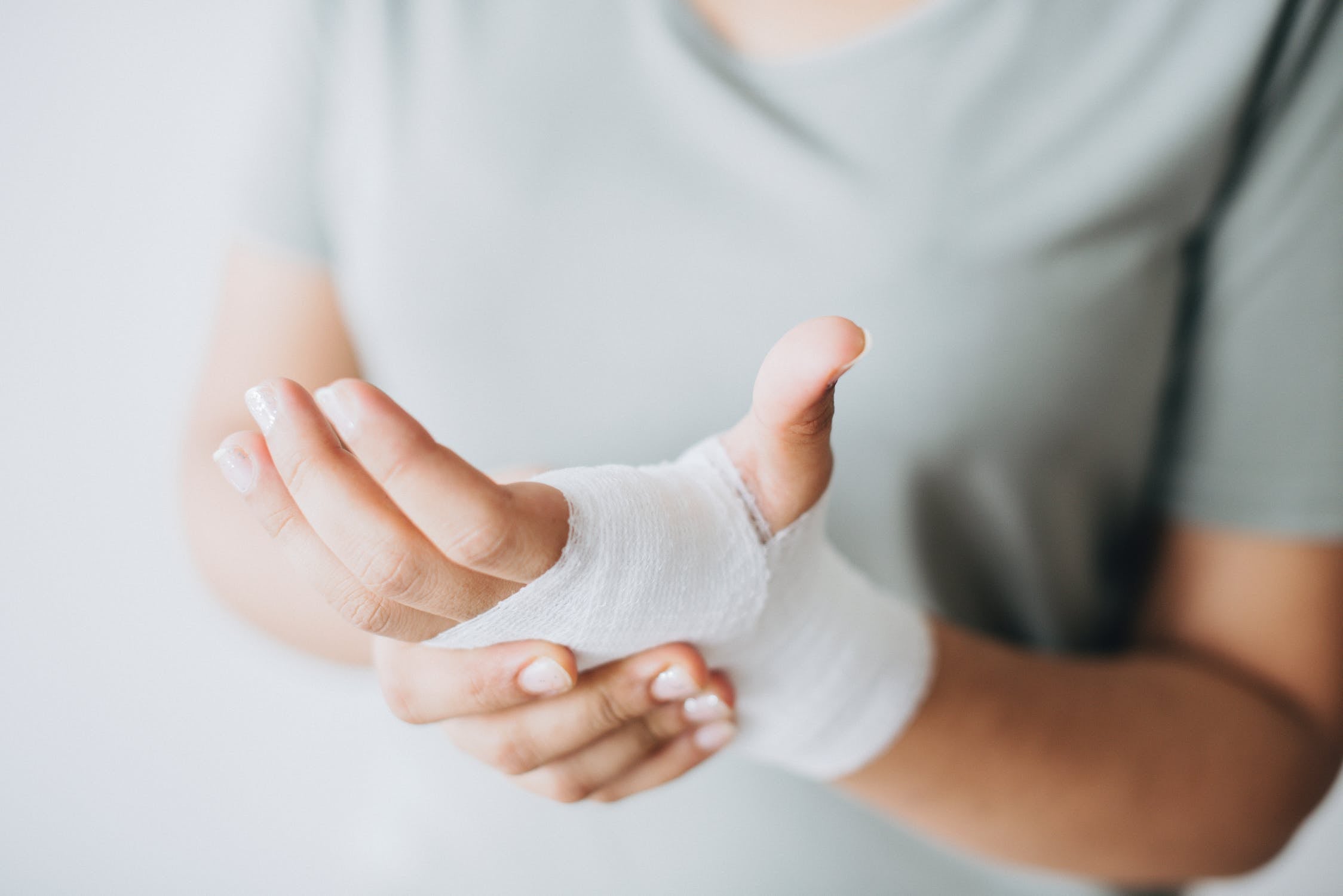 Hand wrapped in a bandage.
