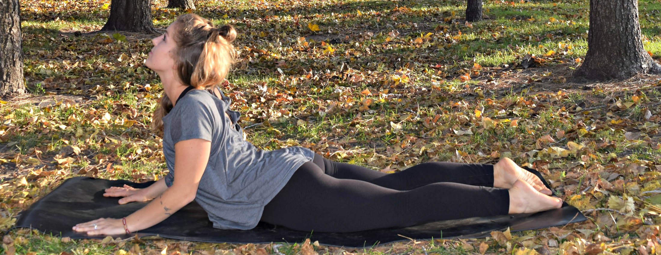 Young woman demonstrating cobra pose