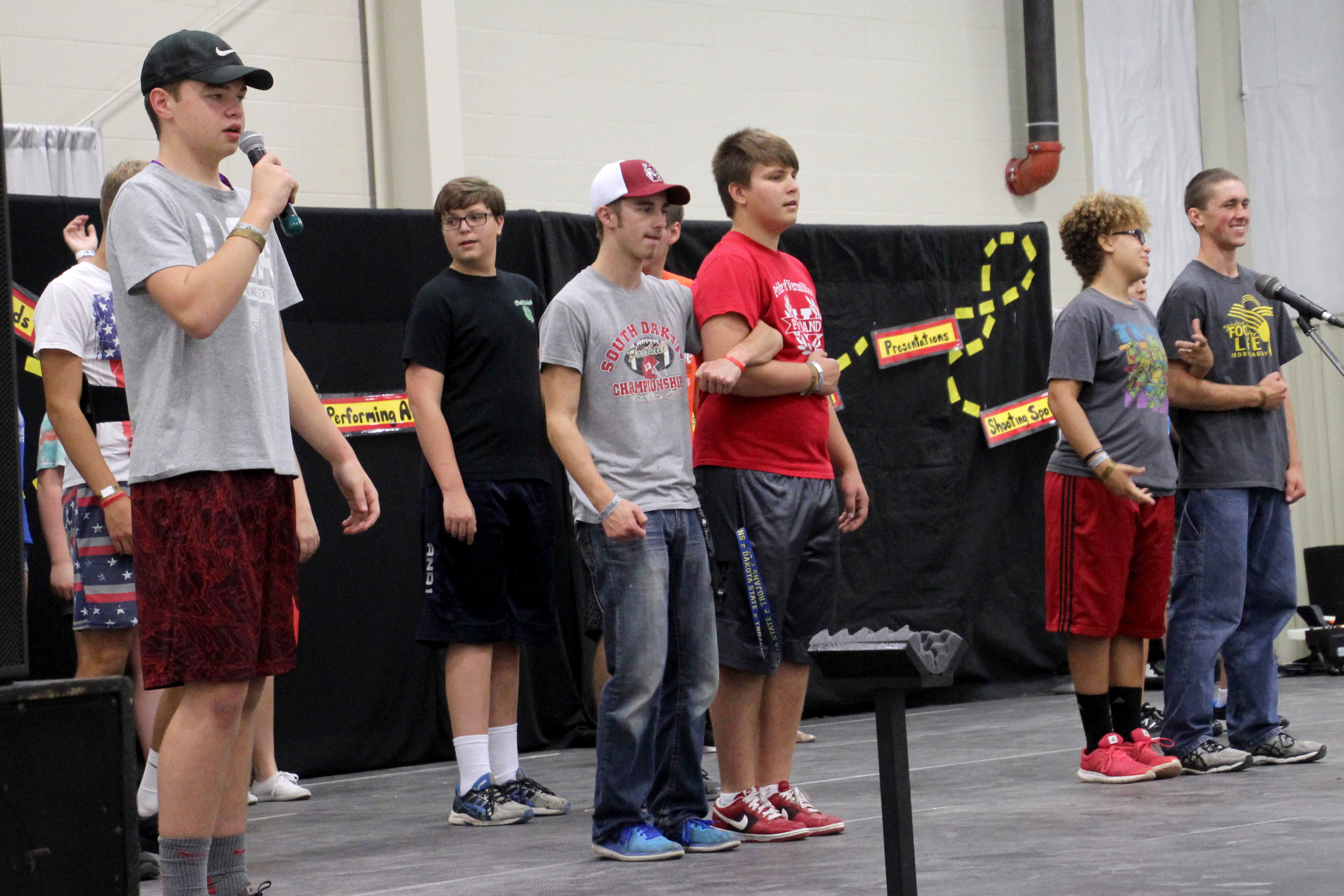 group of male 4-H youth performing a sketch