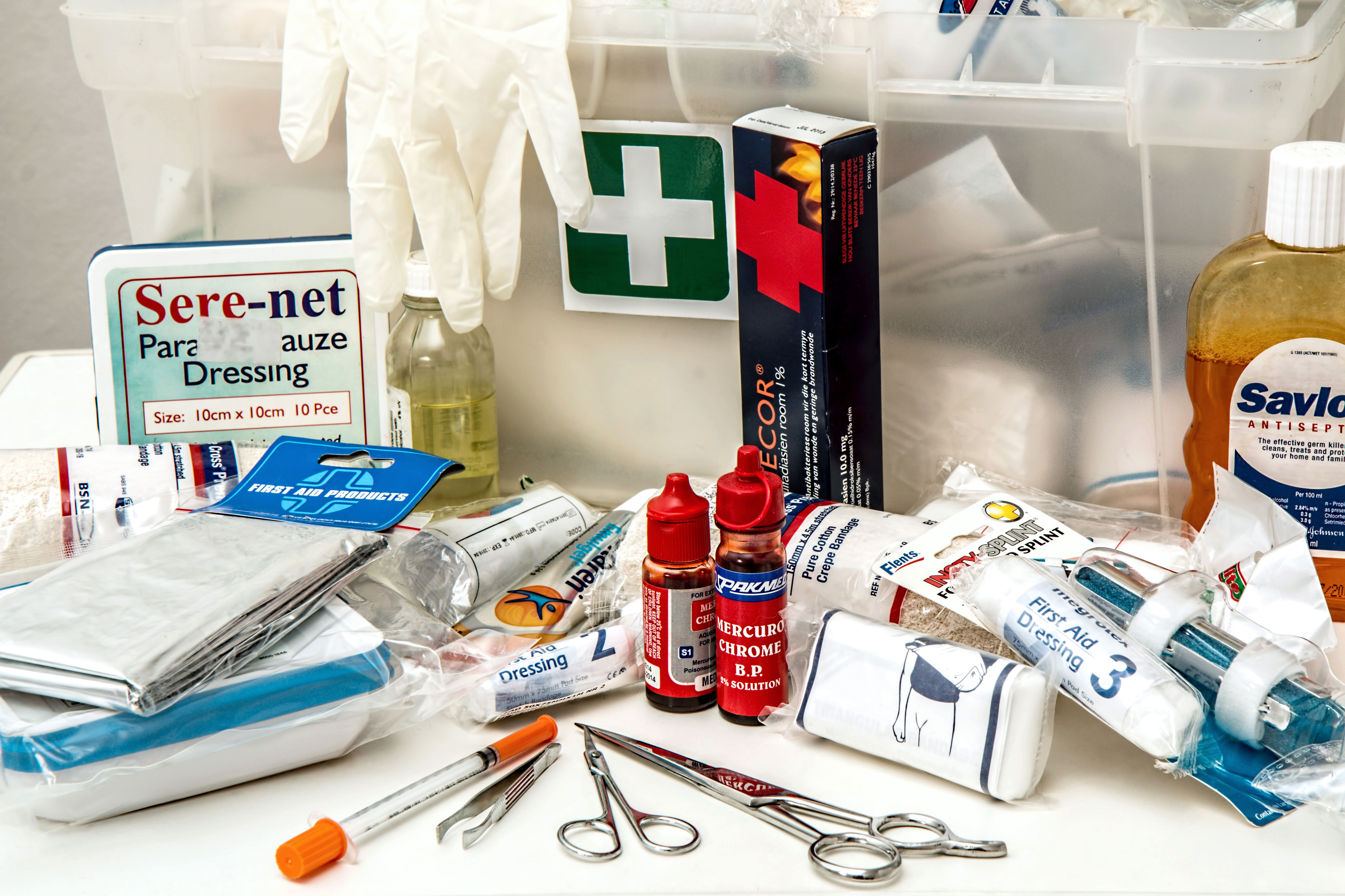 a first aid kit with various medical supplies