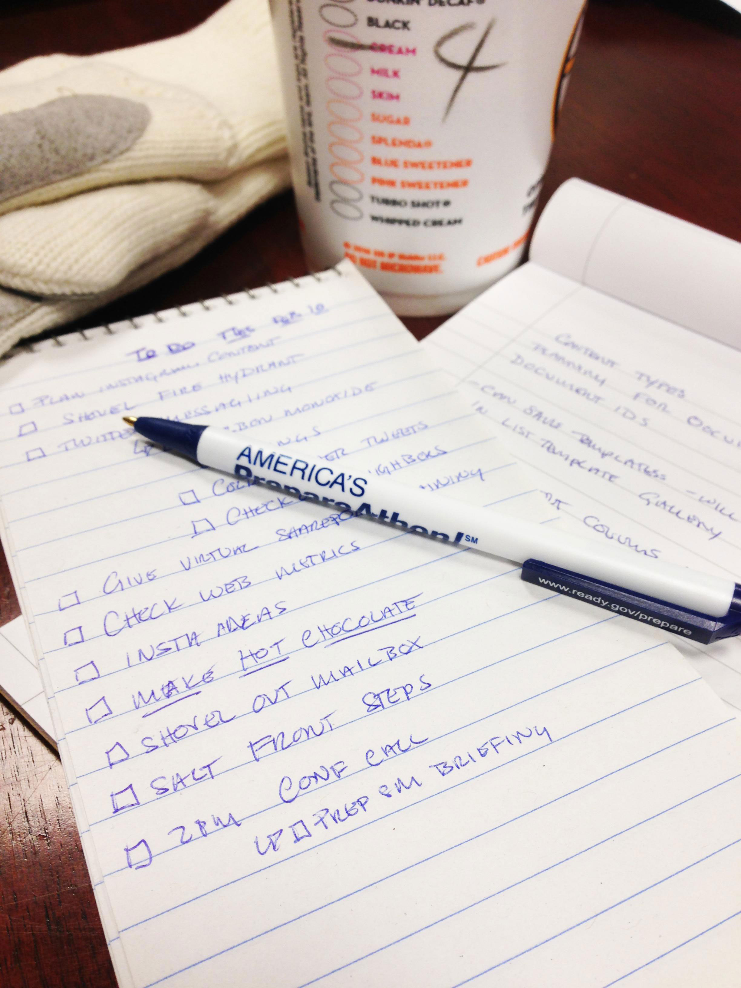 a business checklist written on a pad with a pen. Photo by Eilis Maynard, FEMA