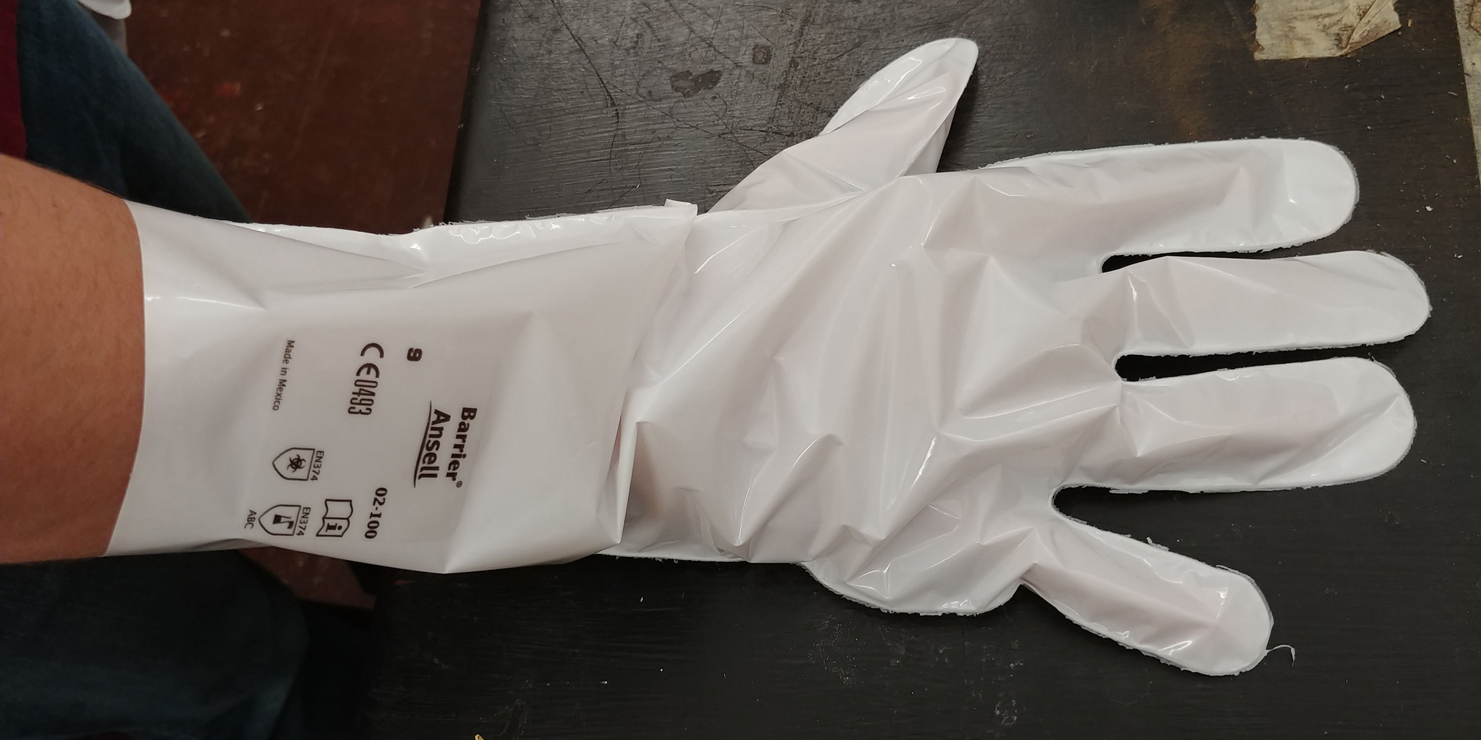 White glove made out of barrier laminate material.