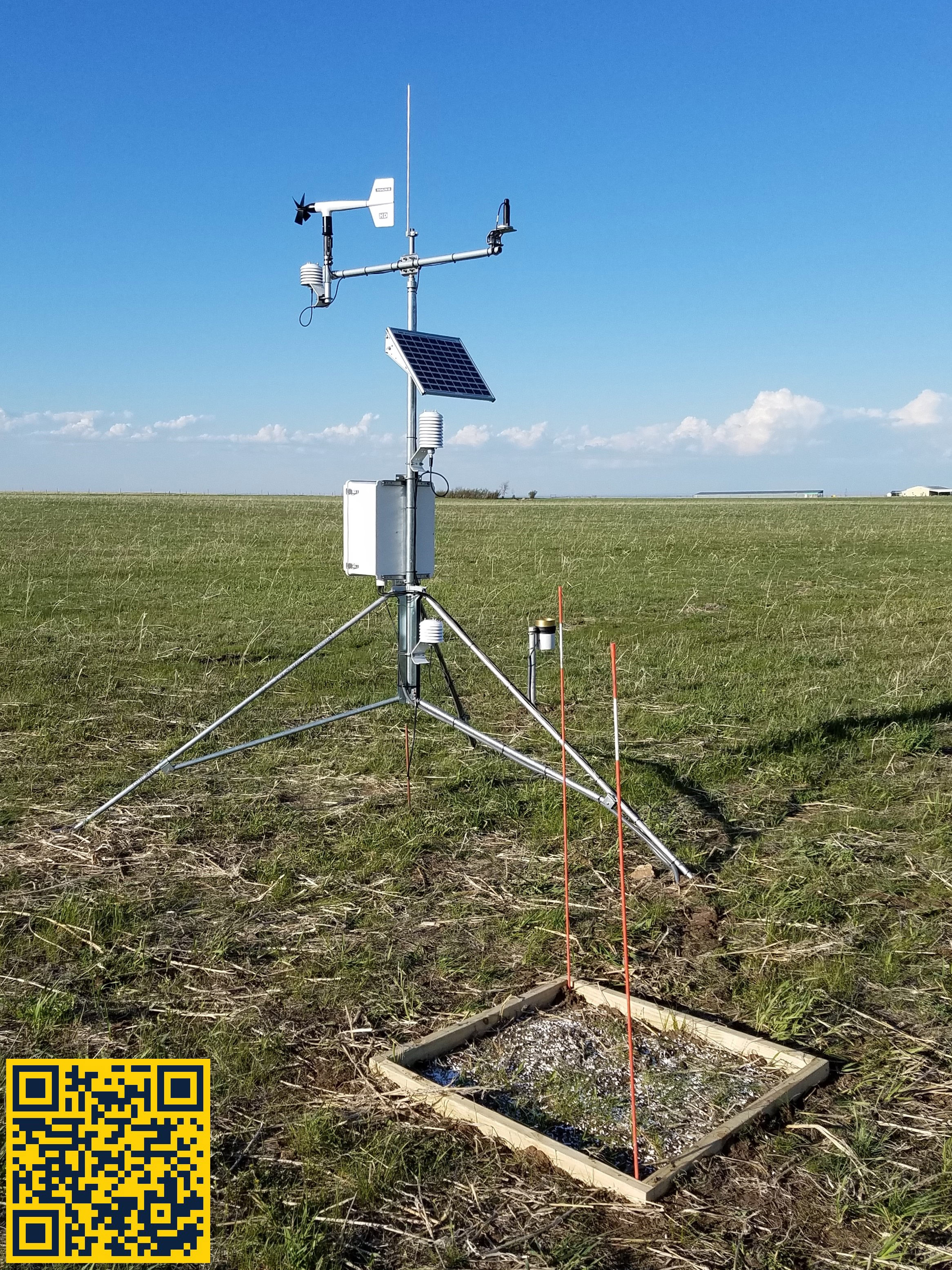 an image of outdoor weather monitoring equipment in a field