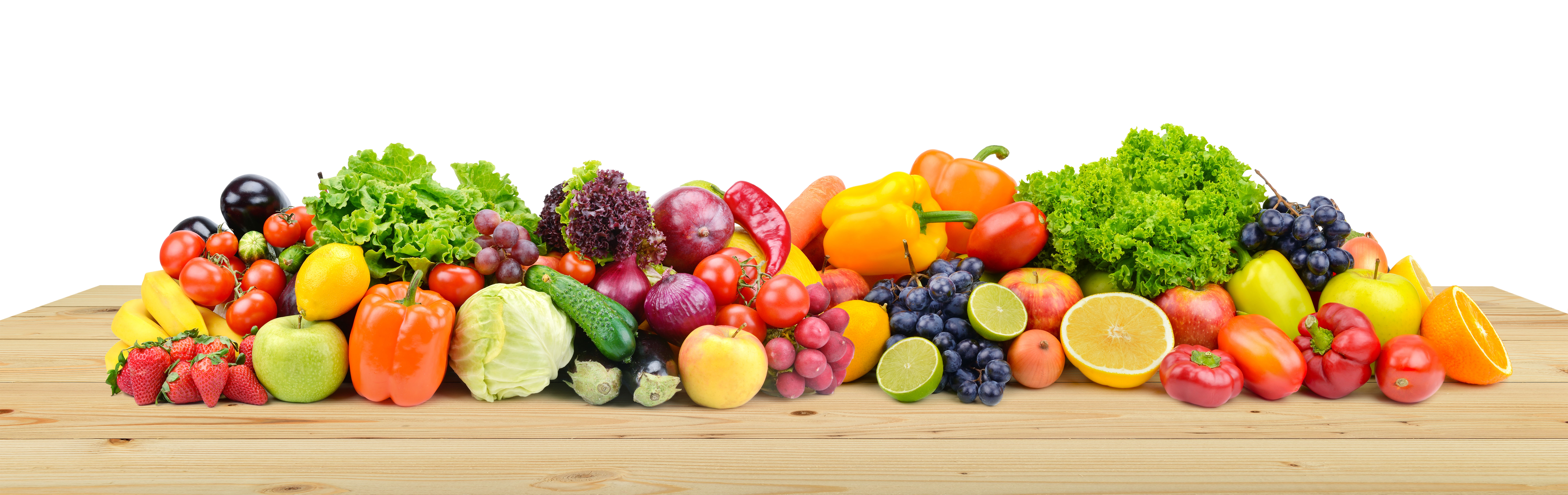 A variety of fresh fruits and vegetables displayed on a countertop.