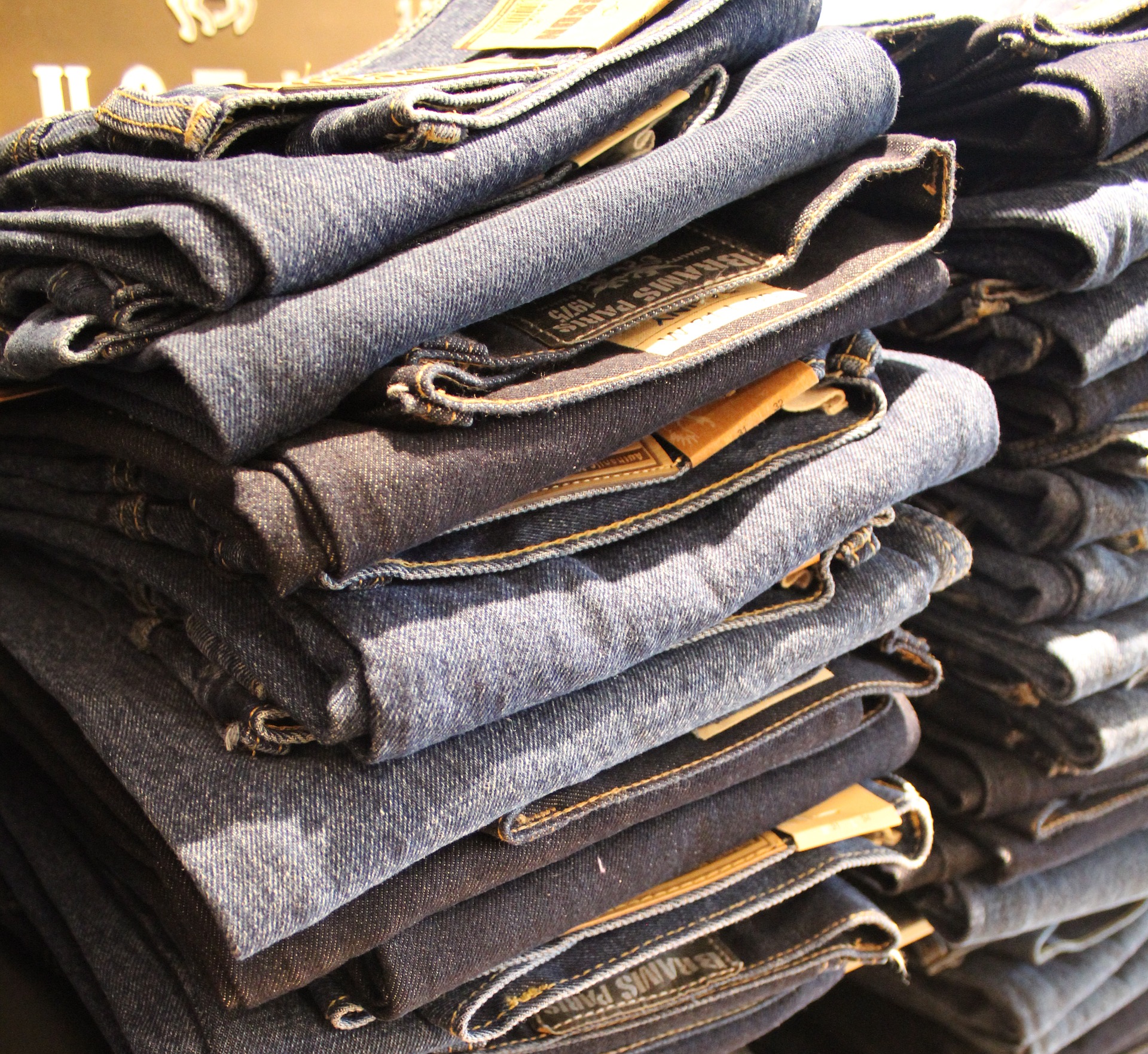 an image of several stacks of blue jeans