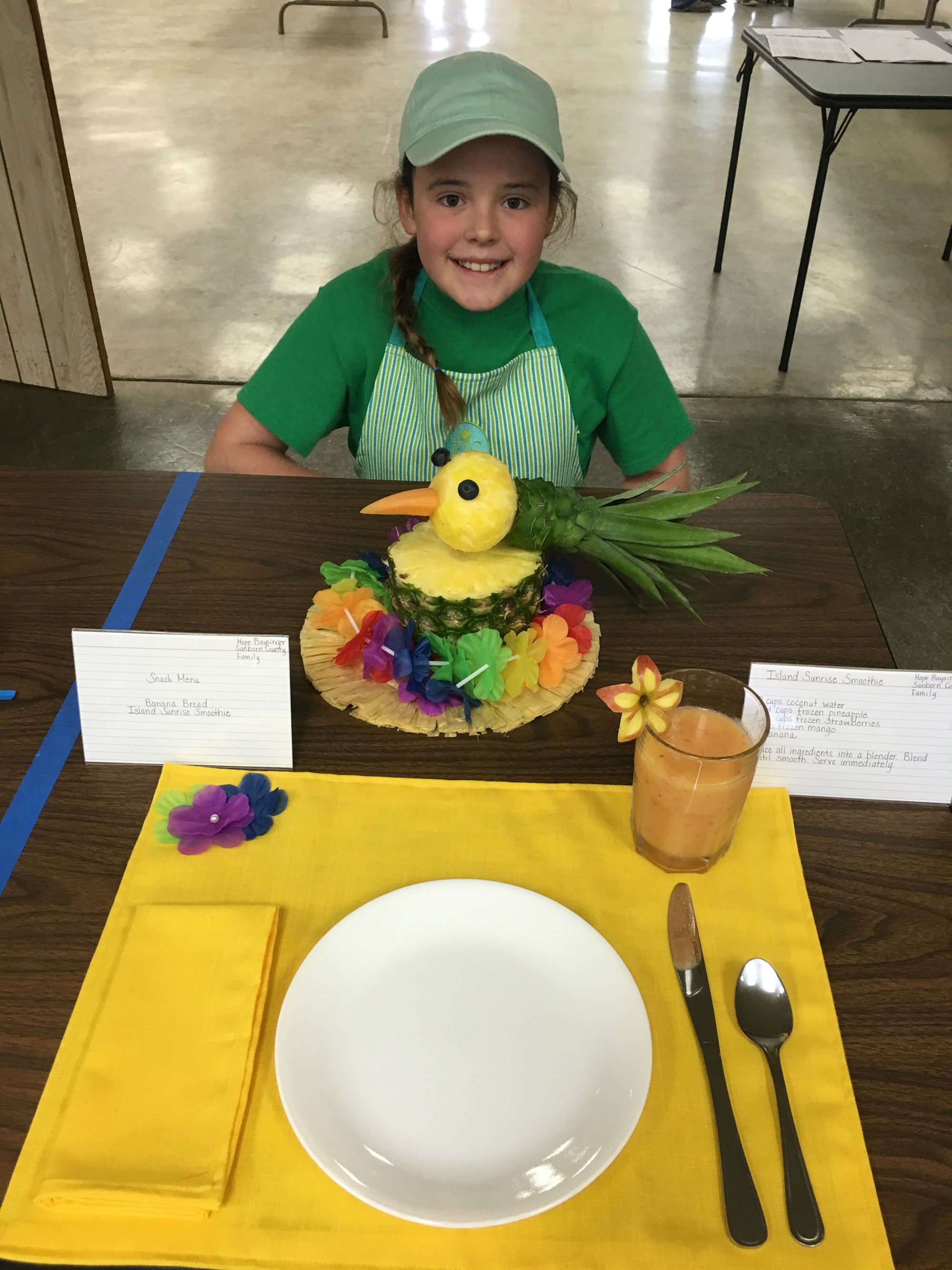 Hope Baysinger presenting a special foods project at a table.