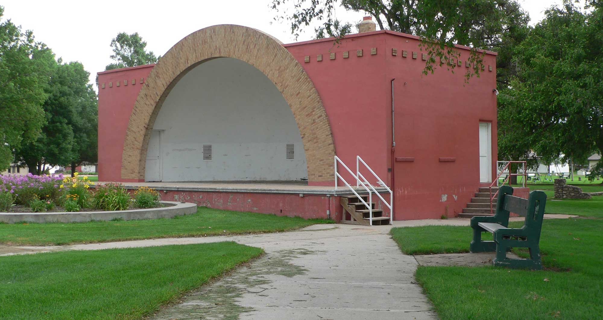 A bandshell in a small community park.