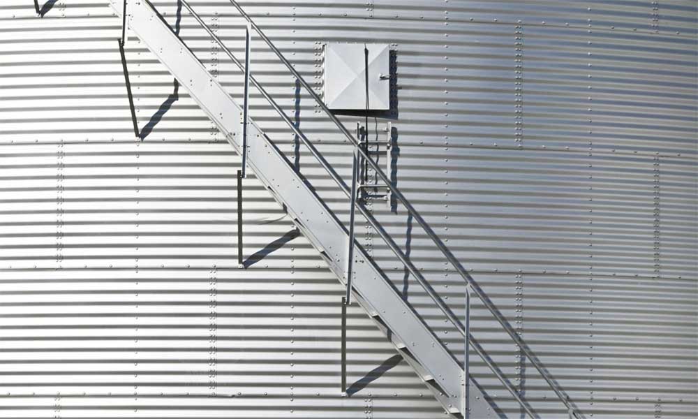 Modern grain bin exterior with built-in staircase.