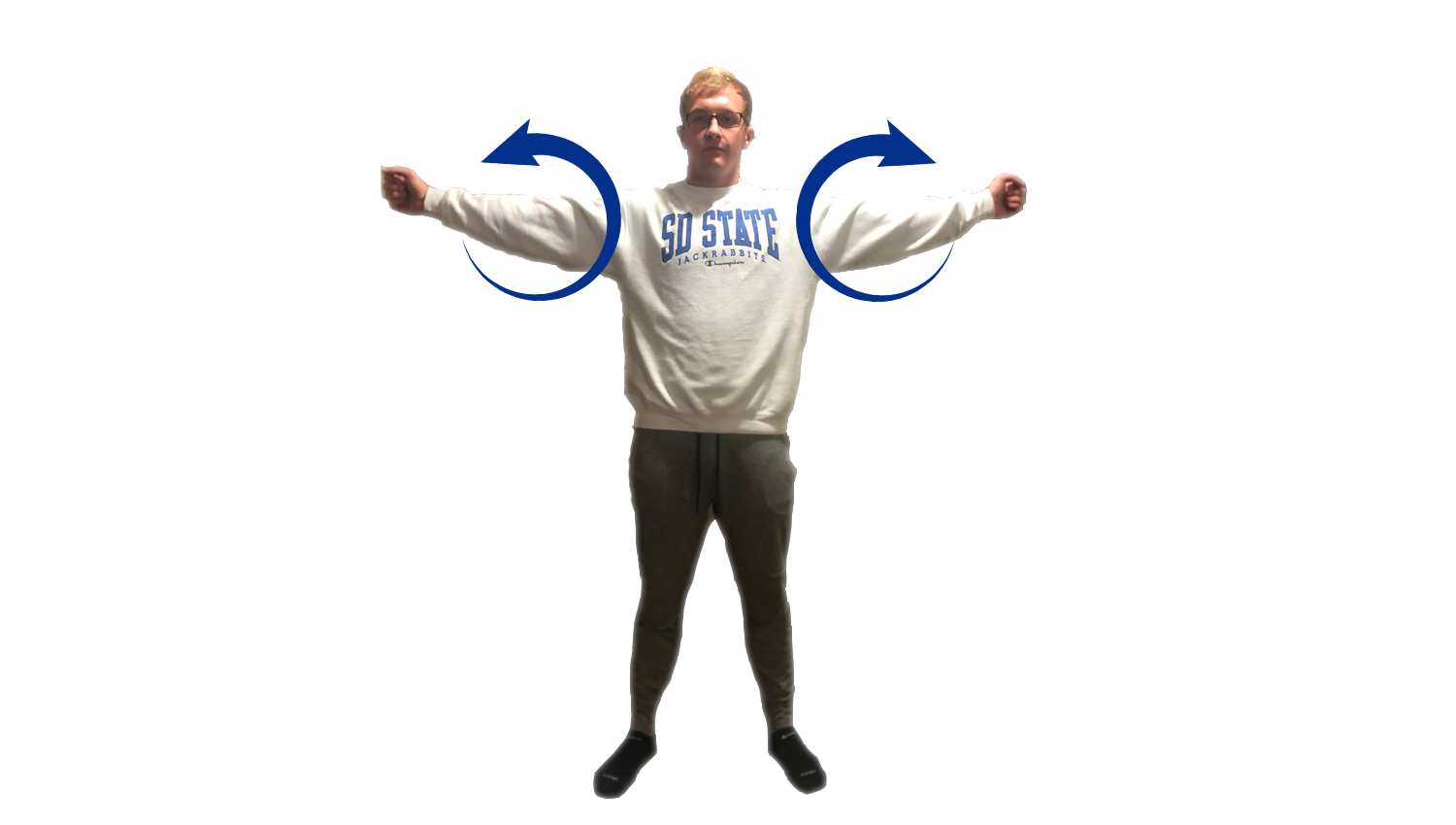 Young man demonstrating the shoulder circles exercise. For a complete description, call SDSU Extension at 605-688-4792.