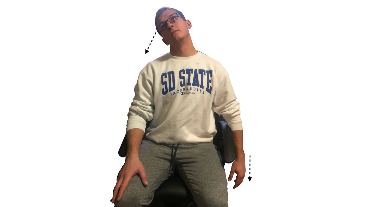 Young man demonstrating the head tilt stretch. For a complete description, call SDSU Extension at 605-688-4792.