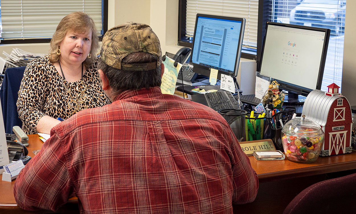 Loan officer meeting with a producer.