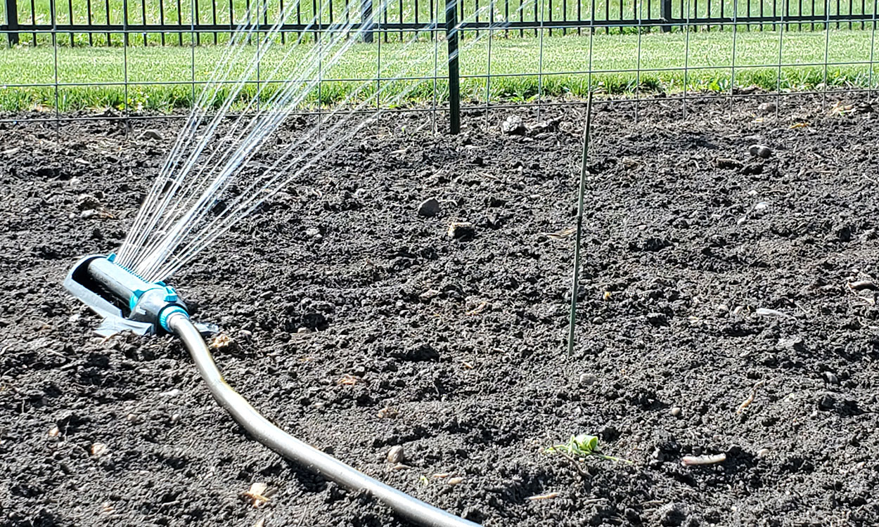 Figure 1. Oscillating sprinkler watering a garden.