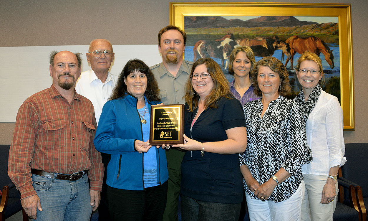 SDSU Extension community vitality team presenting an award.
