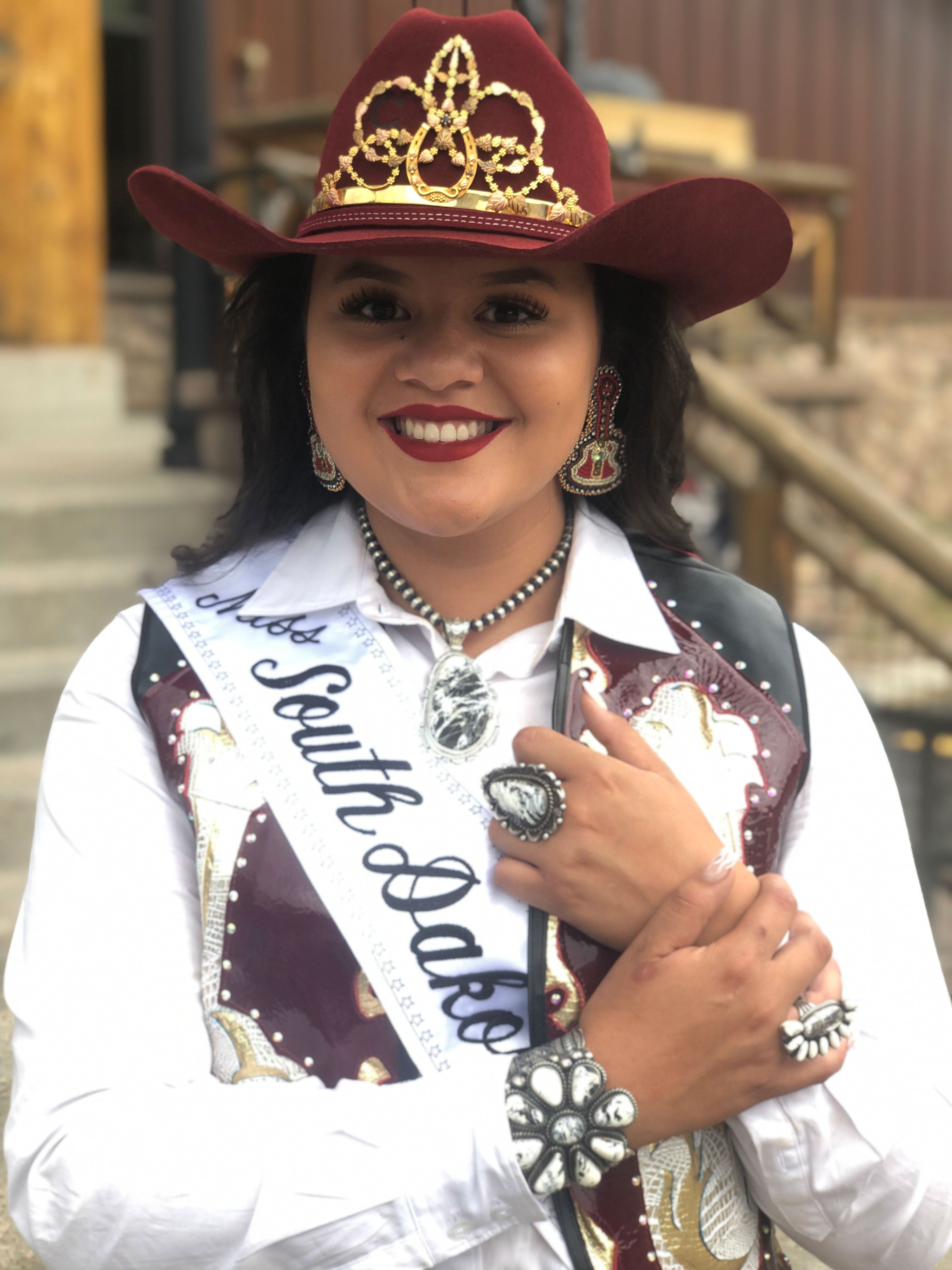 Tashina Red Hawk dressed in her ceremonial South Dakota High School Rodeo Queen outfit.
