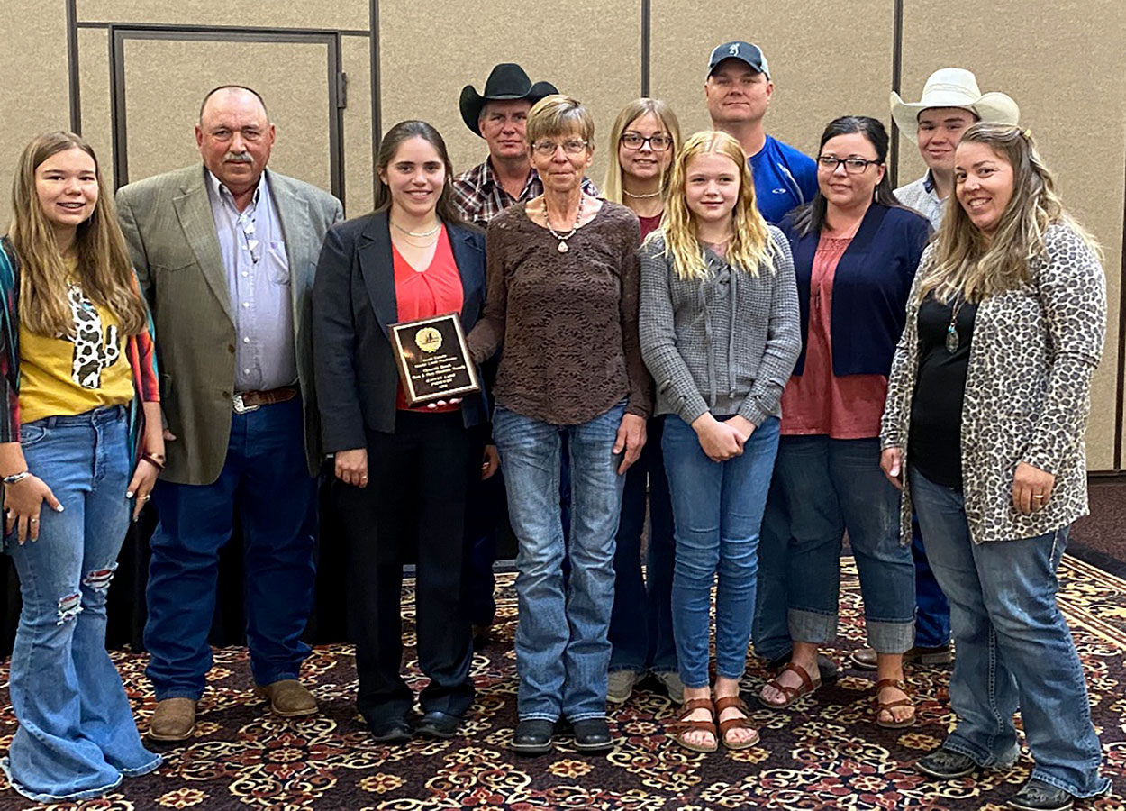Clements Ranch staff accepting their Master Lamb Producer award from SDSU Extension's Kelly Froehlich.
