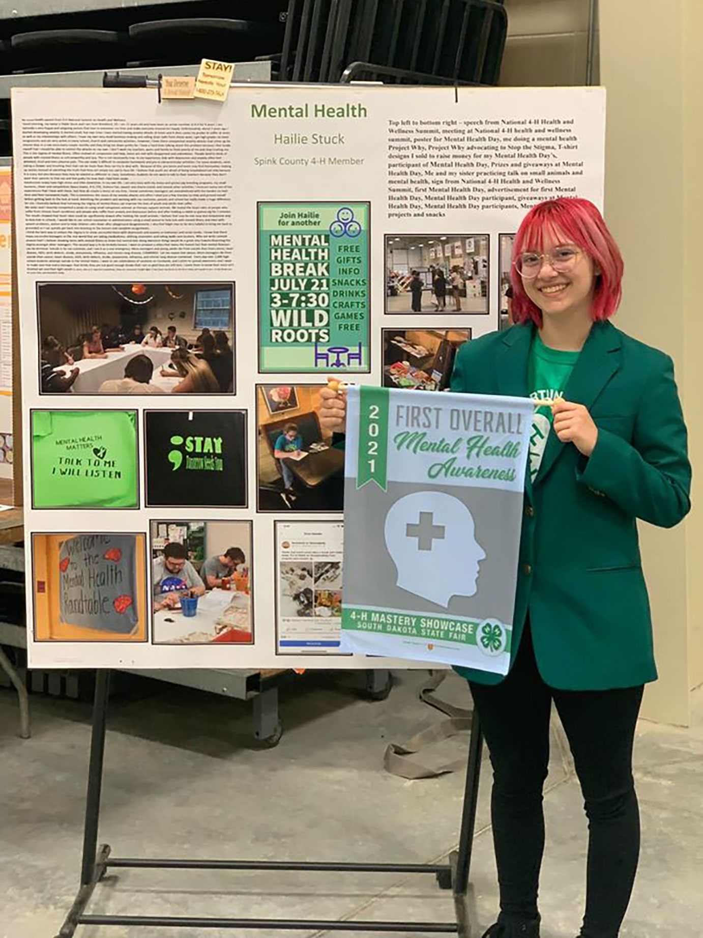 4-H memberHailie Stuck standing next to her mental health presentation.