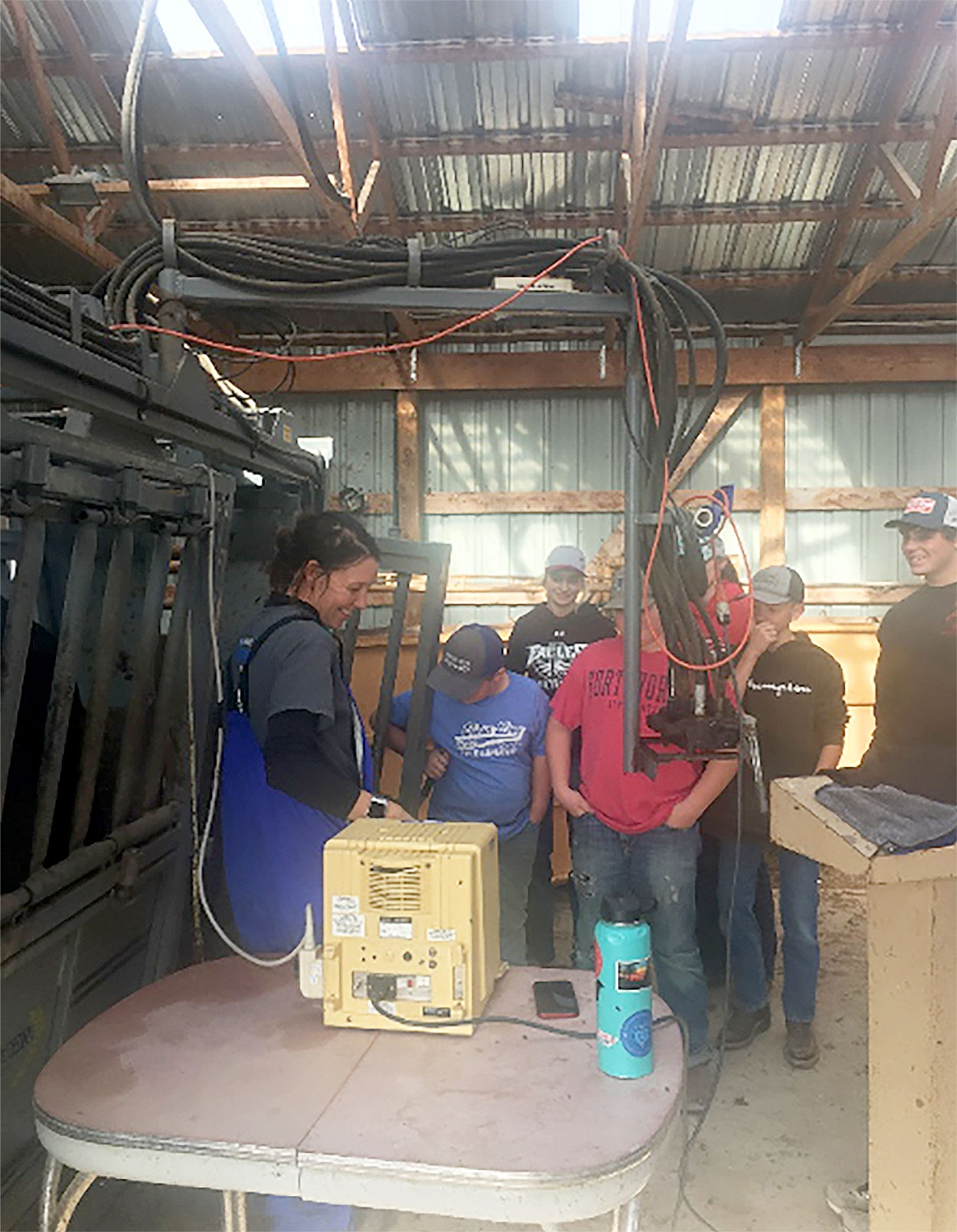 Olivia Amundson, SDSU Extension Cow/ Calf Specialist, demonstrating an ultrasound machine to a group of 4-H youth.
