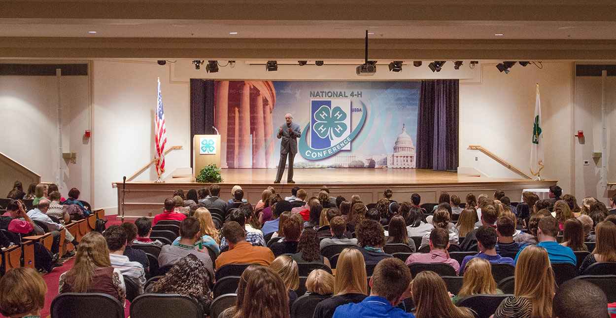 Keynote speaker presenting attendees at the 4-National Conference.