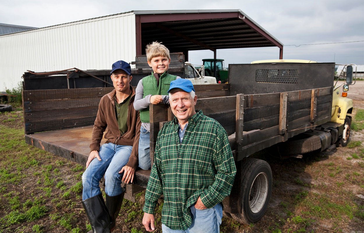 Three generations of men on the family farm.
