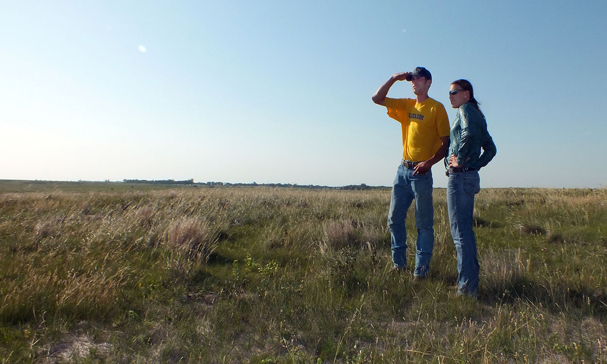 Producers surveying a rangeland site.
