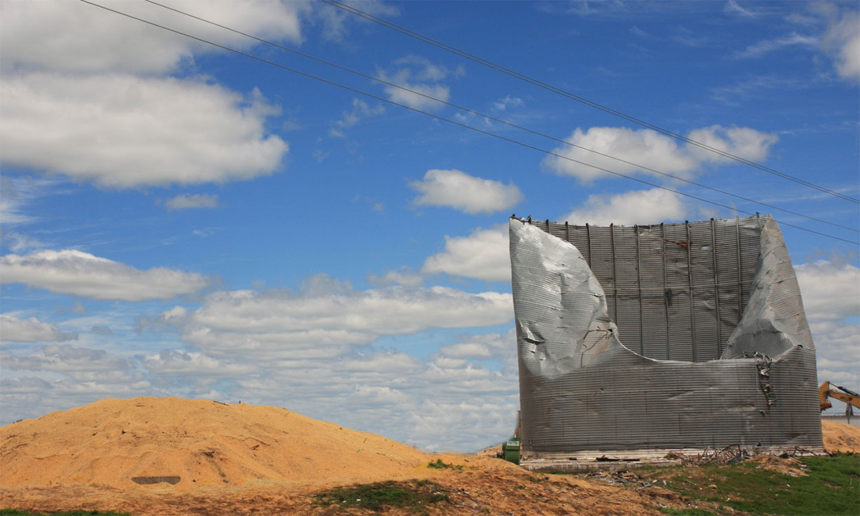 Grain bin damaged by a windstorm.