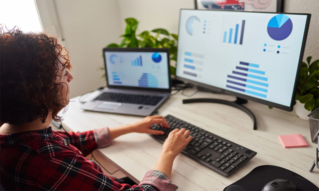 Woman working remotely in a home office.