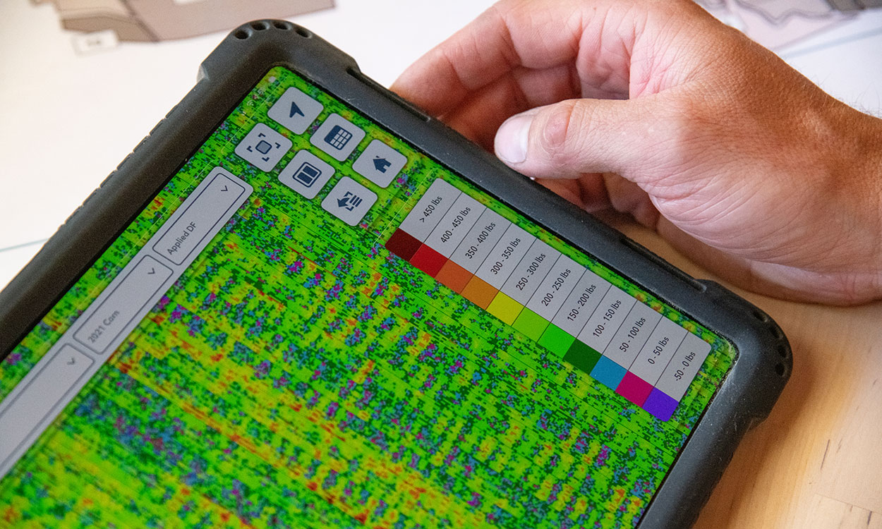 Tablet computer displaying precision planting data.