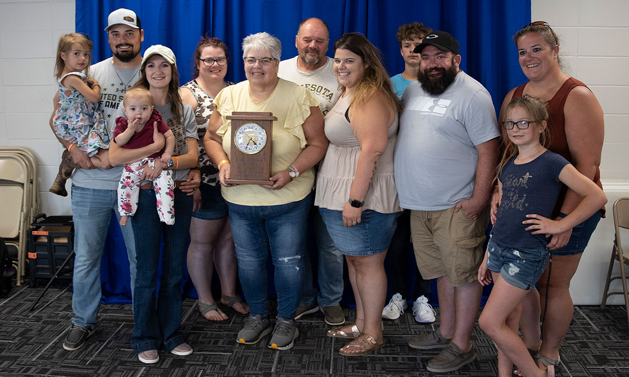 2022 4-H Volunteer Hall of Fame Awardee with family.