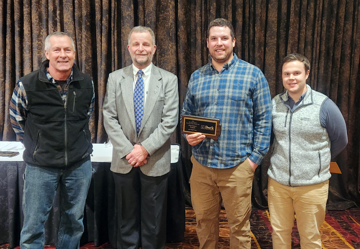 2022 Master Pork Producer Winners Four men stand in a row at the 2022 Master Pork Producer awards