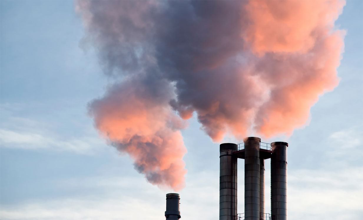 Smokestacks against a blue sky.