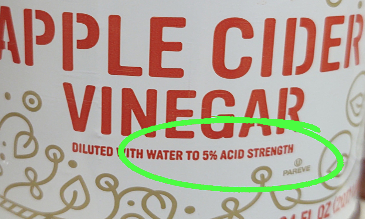 Apple cider vinegar label with 5% acidity text circled in green.