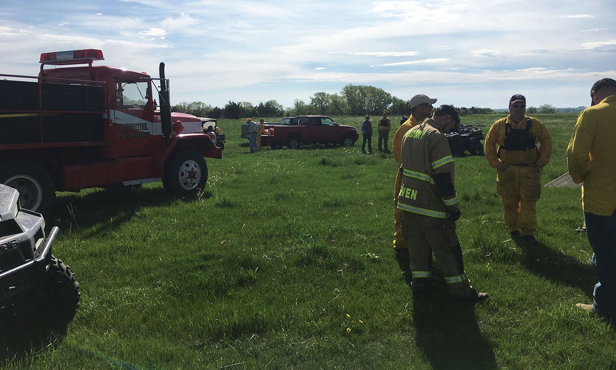 Members from several fire departments gathered before a prescribed burn.