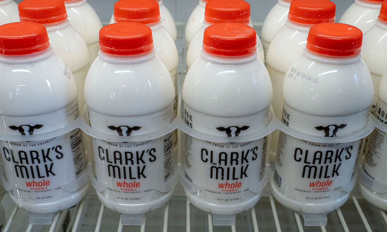 Bottles of on-farm pasteurized and packaged whole milk.
