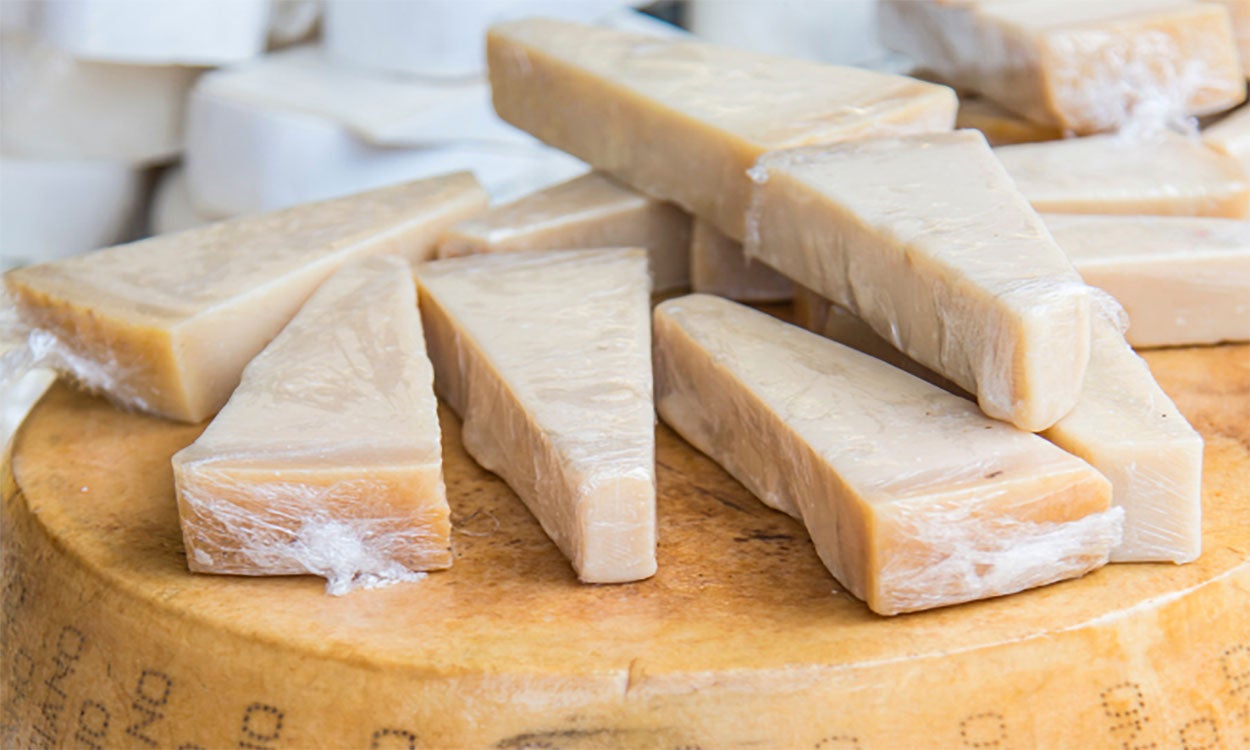 Pieces of raw-milk, parmigiano Reggiano cheese on display.