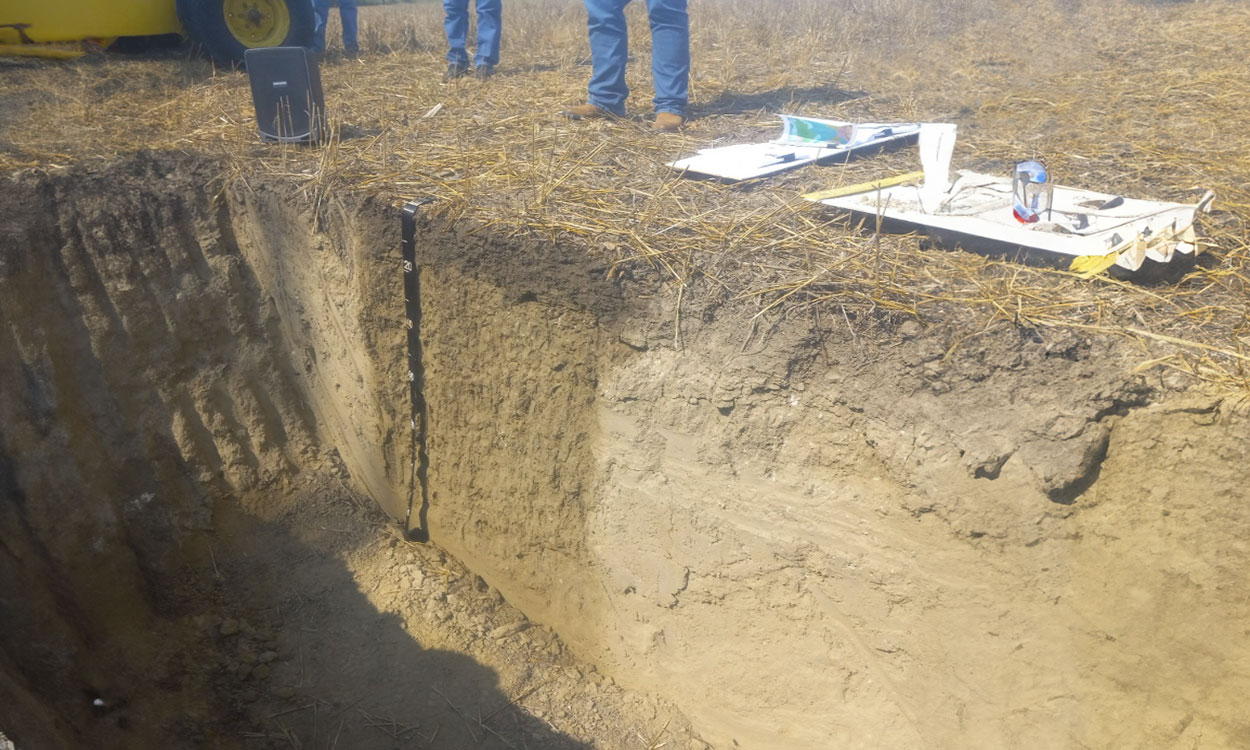 Soil pit revealing the composition and depth of the soil at a research site in Garretson, South Dakota.
