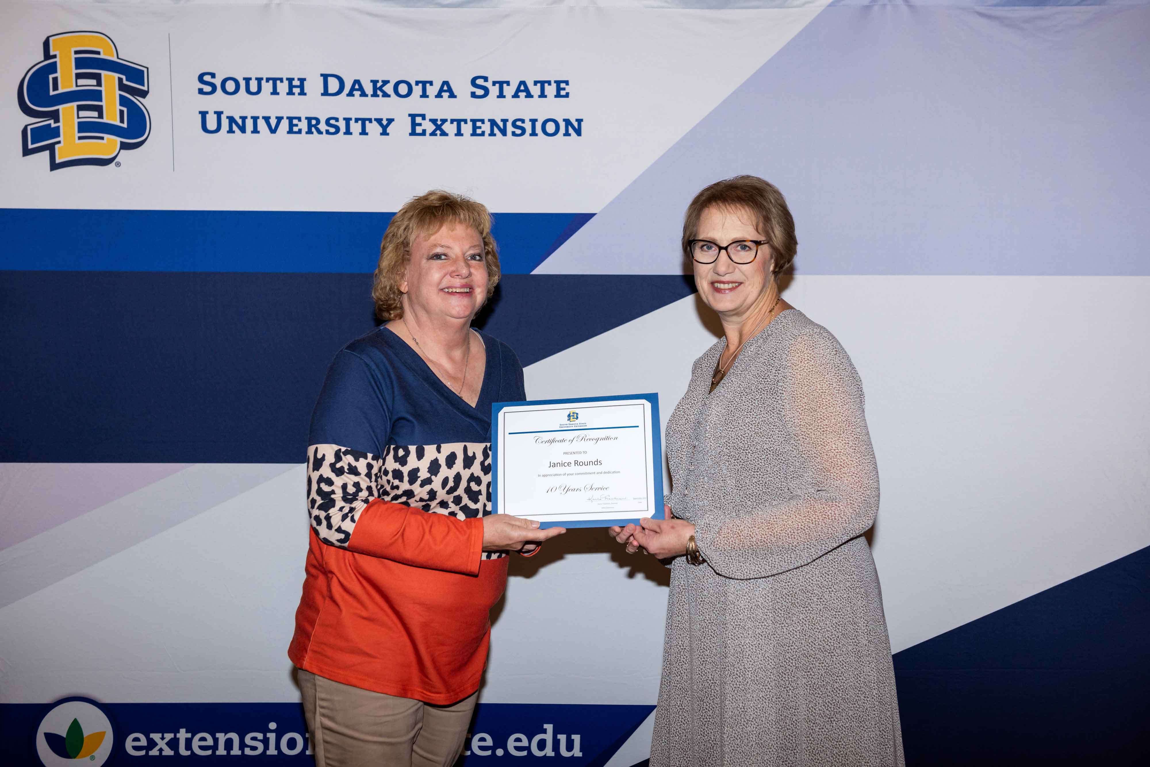 Janice Rounds receives her 10-year certificate from Karla Trautman