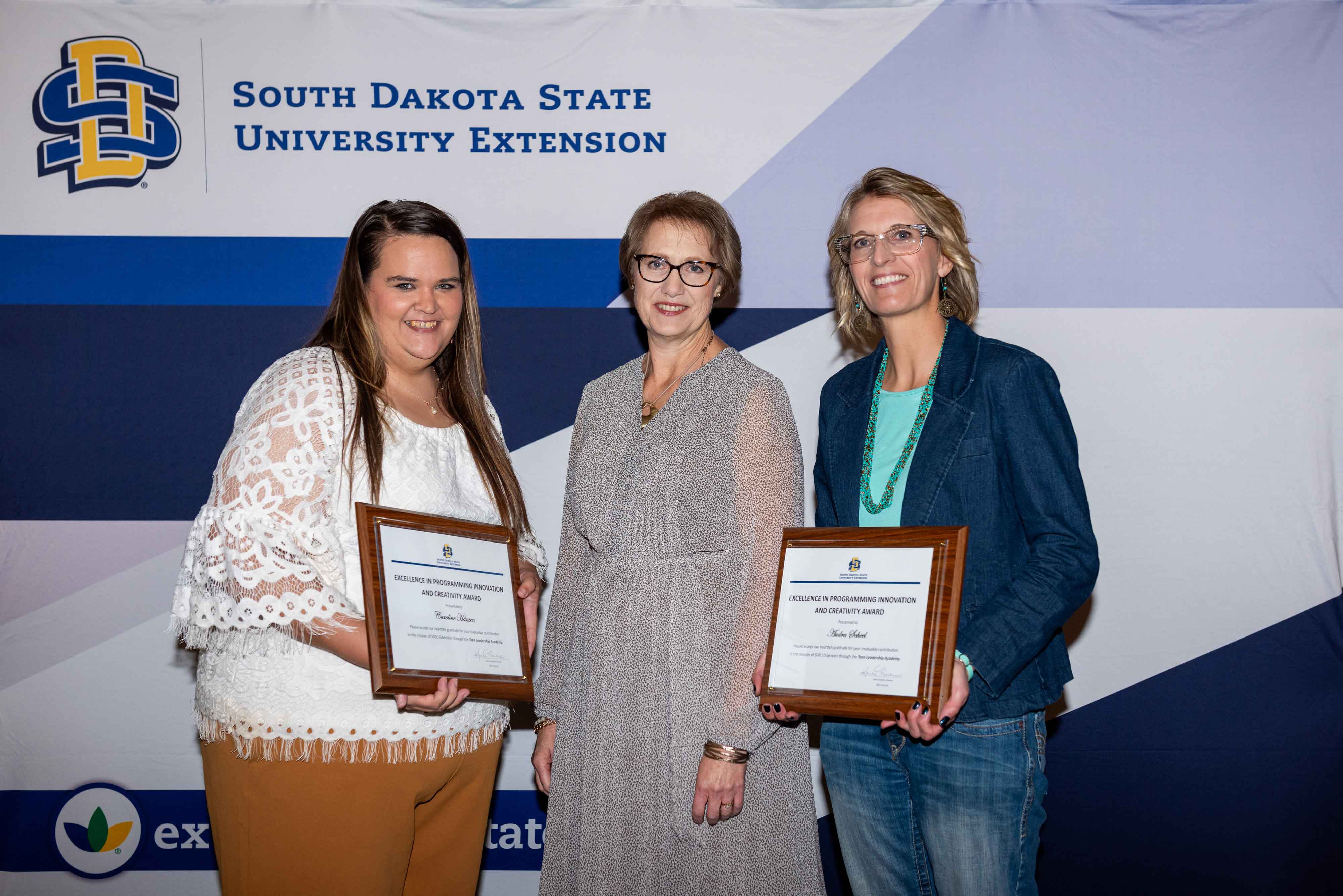From left, Caroline Hansen, Karla Trautman and Audra Scheel smile at the camera