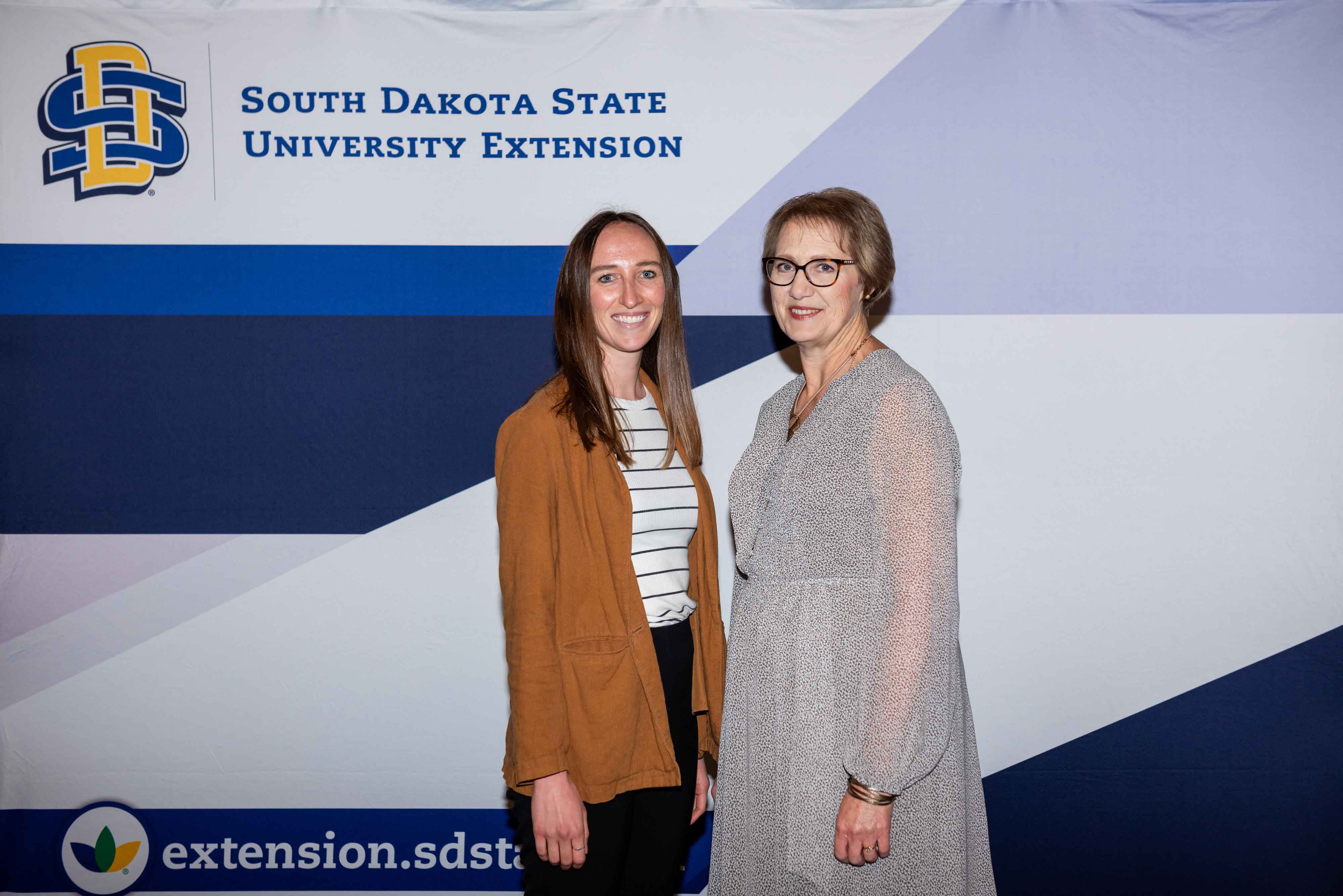 Anna Tvedt smiles at the camera with Karla Trautman