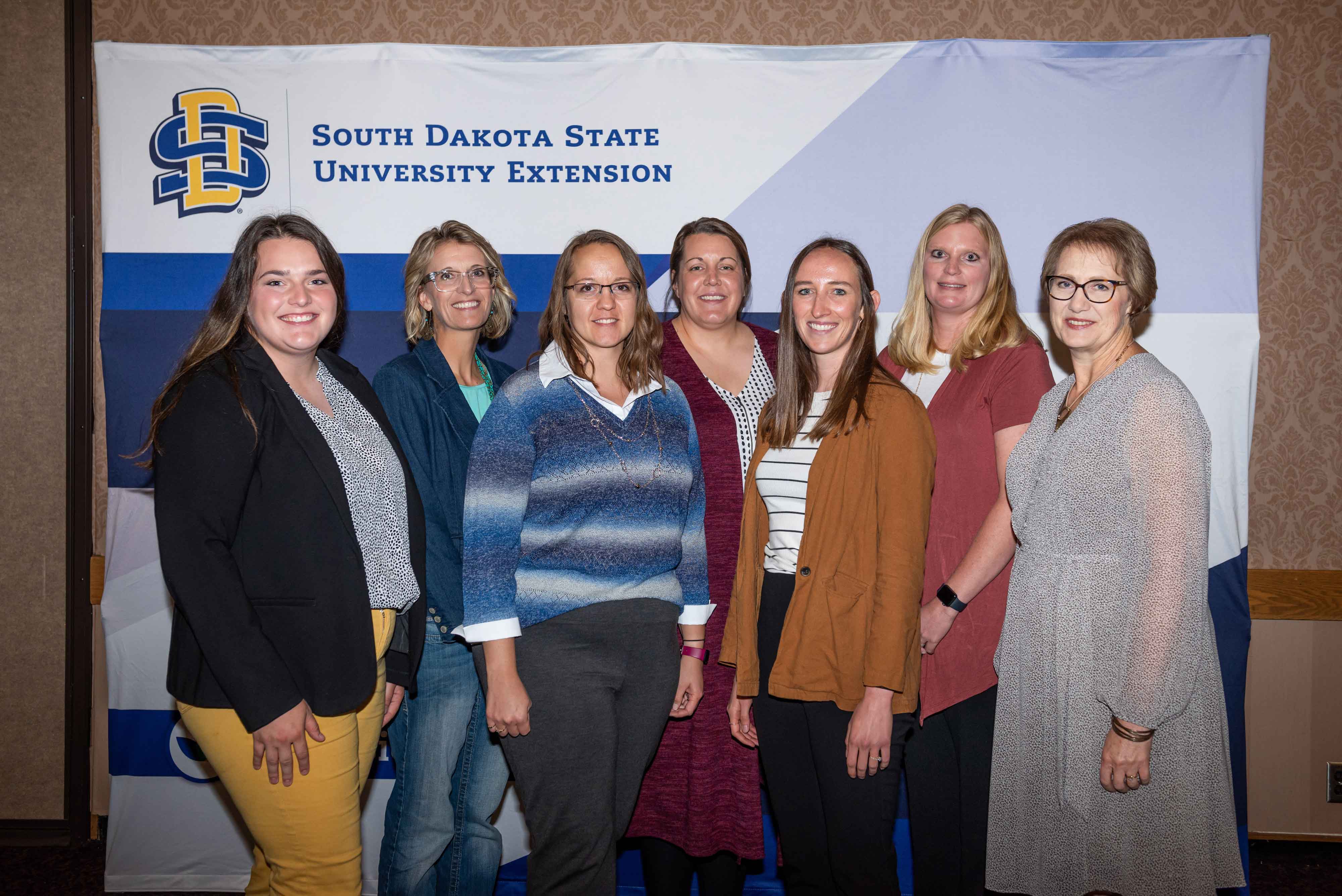 Madison Kovarna, Audra Scheel, Christine Wood, Sara Koepke, Anna Tvedt and Jennifer Hayford received a Multi-Disciplinary Program Seed Grant for the Beef 2 School project from SDSU Extension Director Karla Trautman.