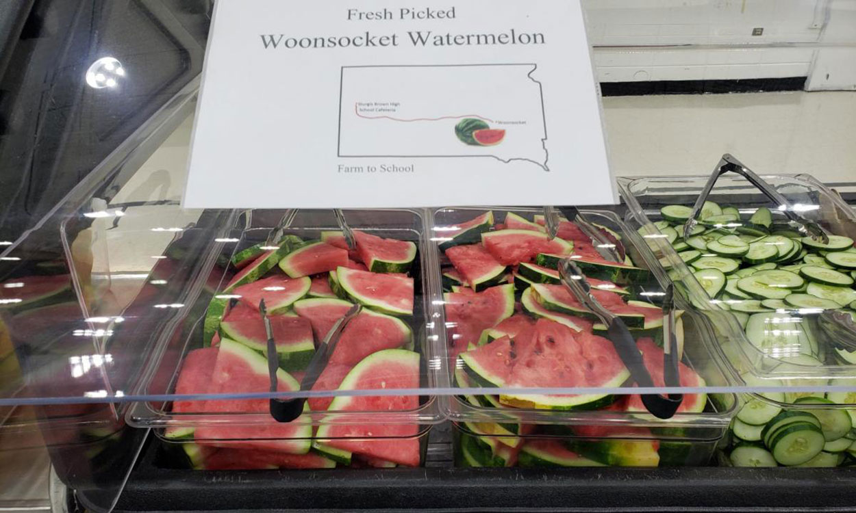 Buffet of locally sourced watermelon served at a school lunch