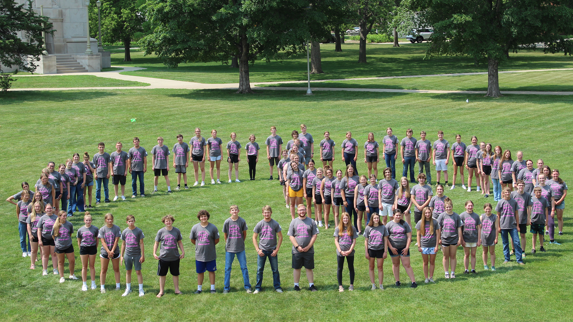 Group photo of 2023 Teen Leadership Conference participants standing in the shape of a clock