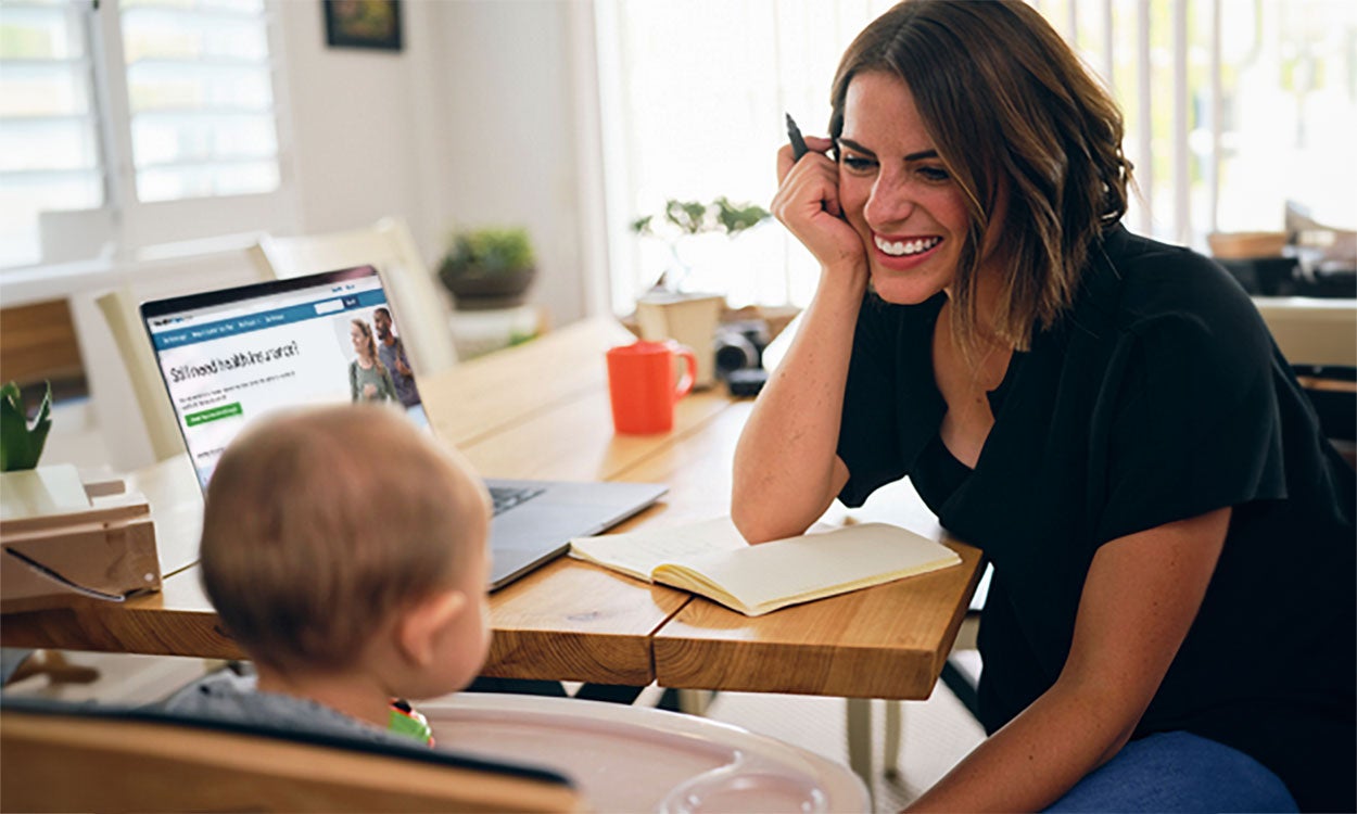 Mother and son at a computer with the health insurance marketplace on-screen.