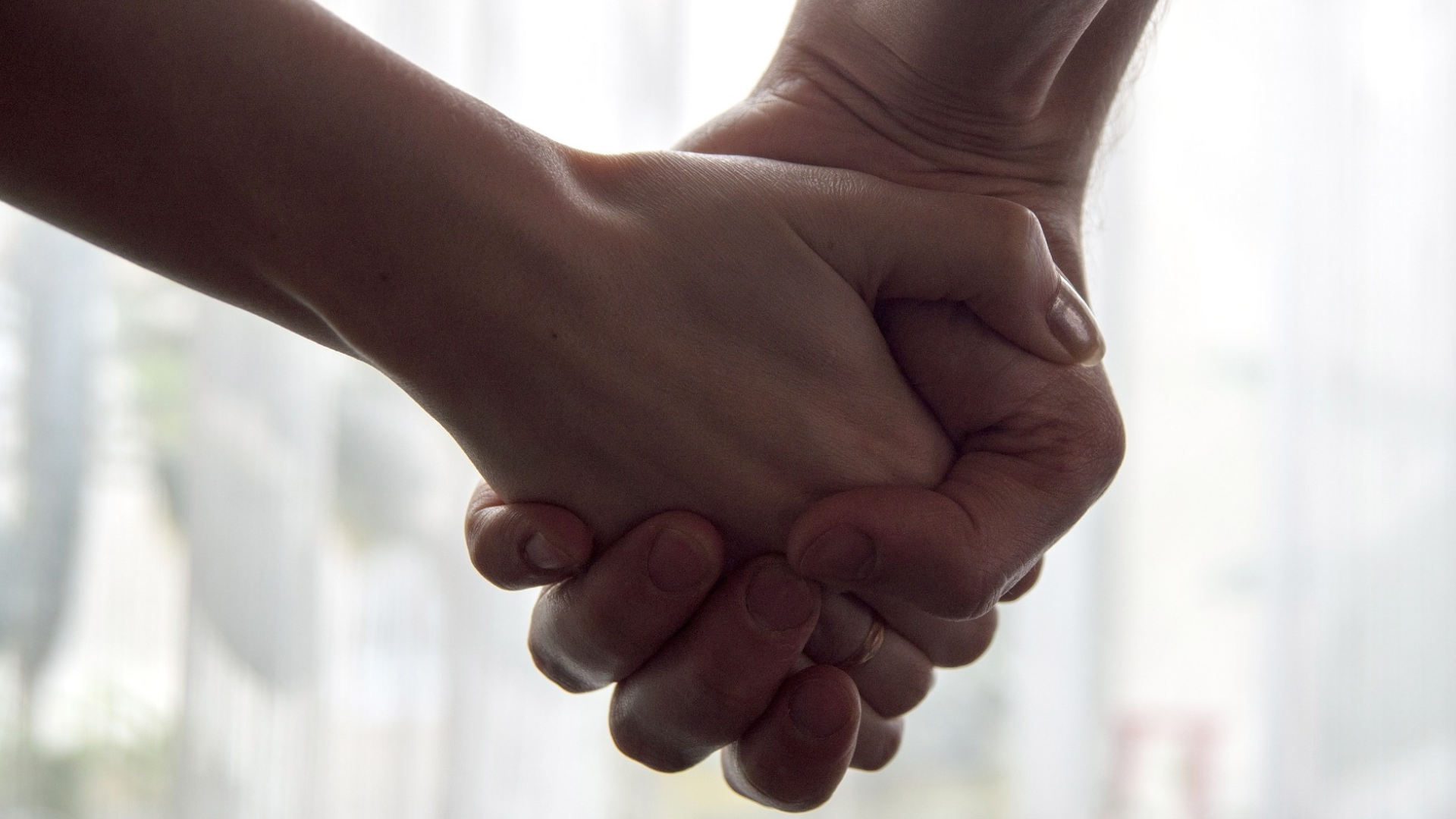 two people holding hands
